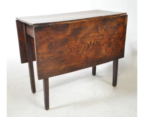 A 19th century George III mahogany drop leaf dining table. Raised on tapering, squared legs having gate leg action. Above, wi