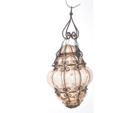 A mid 20th century hand blown Murano Venetian style glass ceiling light shade. Impressed into a metal wirework swirl / twist 