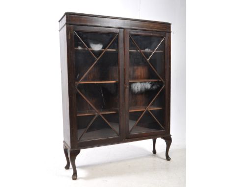 An early 20th century Edwardian mahogany and glazed china display cabinet vitrine. Raised on cabriole legs having twin astrag