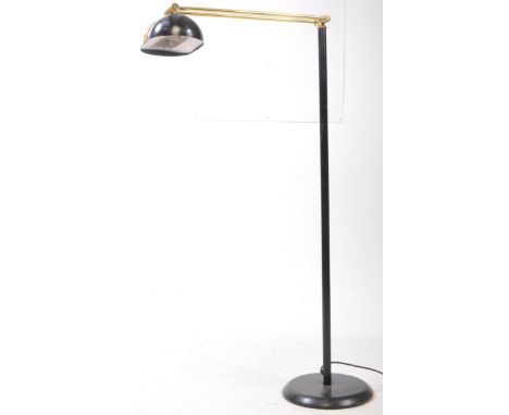 Italian Modern Design - A 20th century industrial style black and gold floor standard lamp. The black terraced base with blac