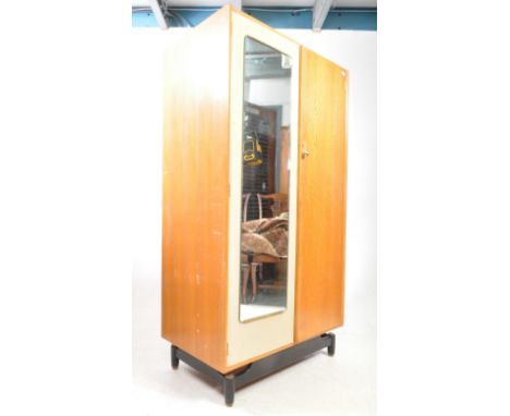 G-Plan Furniture - Librenza Range - A vintage mid century teak wardrobe. Raised on ebonised stub tapering legs with mirror do