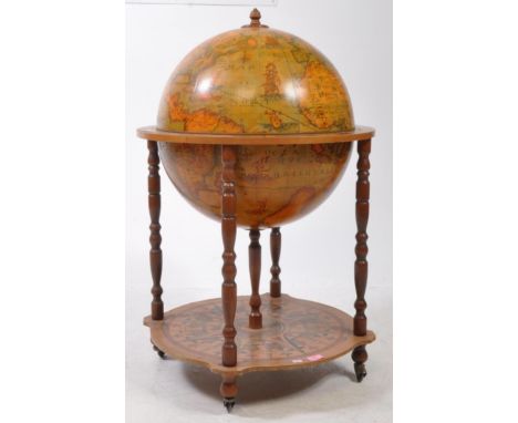 A 20th Century vintage terrestrial mahogany veneer globe drinks cabinet with hinged lid to reveal decanter cocktail cabinet, 