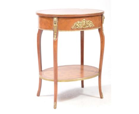 A French Kingwood and parquetry decorated lamp occasional table. Crossbanded top with single drawer with gilt ormolu decorati