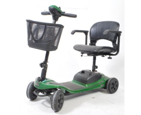 Liberty electric mobility scooter. In racing green colourway RWD, front carry basket, lift up elbow rest with instruction man