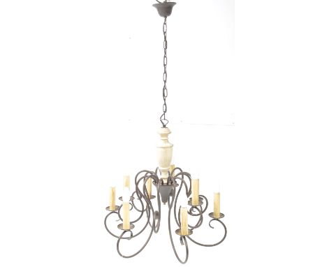 A contemporary Bronze style curved hanging ceiling light chandelier. With 9 branch arms light fixing to top, vase / urn centr