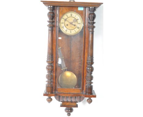 An early 20th century walnut 8-day regulator wall clock by manner GB Gustav Becker. Having an eight day movement with white f