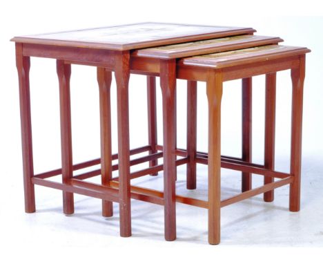 Danish Modern Design - A vintage 20th century tile top teak nest of tables, with tile tops rectangular form on upright square