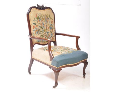 A late 19th century Victorian mahogany Gainsborough manner tapestry upholstered armchair. The chair raised on short cabriole 