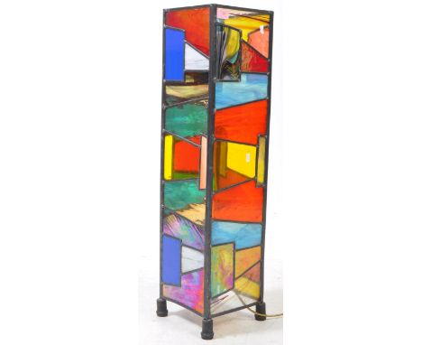 A vintage mid 20th century leaded stained glass low floor standing lamp. The lamp of rectangular prism form, with stained gla