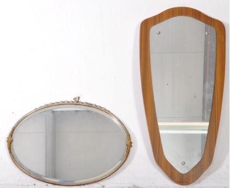 A collection of two vintage 20th century wall hanging mirrors. The collection to include a mid century British Modern Design 