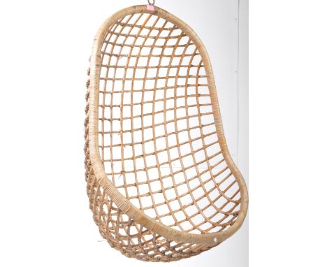 A retro vintage style 20th Century hanging basket chair / pendulum egg chair. The hanging chair being of wicker construction 
