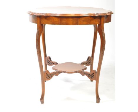 Late 20th century Edwardian style reproduction mahogany occasional table. Features a carved circular top with stepped edges m
