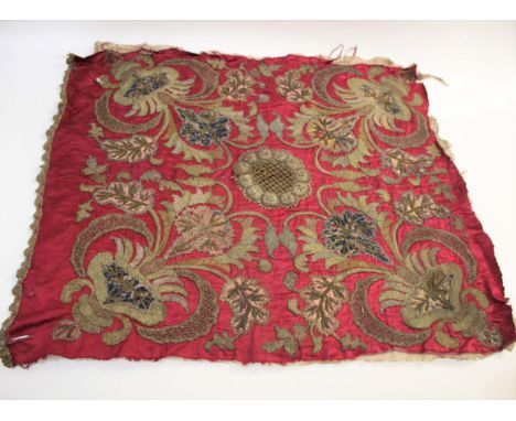 SILK TAPESTRY PANEL probably 18thc, a silk and metal thread panel working in various stitches on a dark red ground. Centred w
