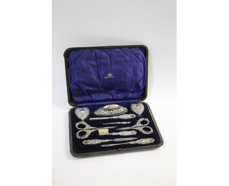 CASED SILVER MANICURE SET - MAPPIN &amp; WEBB a leather fitted case, with a variety of silver manicure tools including scisso