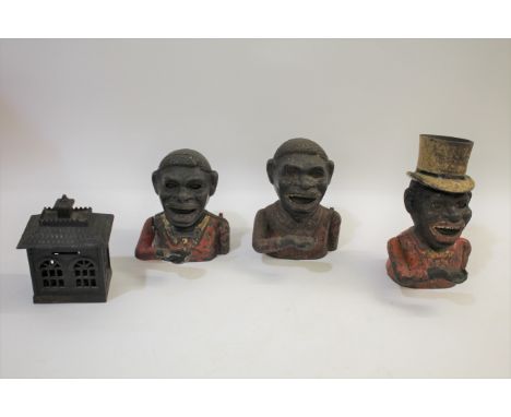 VINTAGE MONEY BOXES including 3 Jolly Nigger cast iron money boxes, one with a Top Hat (2 marked on the back). Also with a St