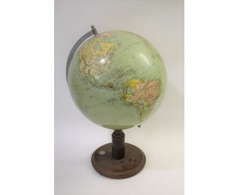 VINTAGE GLOBE  a large globe mounted on a wooden stand, and with a compass set into the base. With a metal bracket on one sid