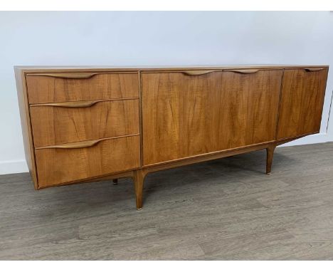 TOM ROBERTSON FOR MCINTOSH OF KIRKCALDY, 'DUNVEGAN' TEAK SIDEBOARD, CIRCA 1960-69 with twin cupboard doors flanked by three g