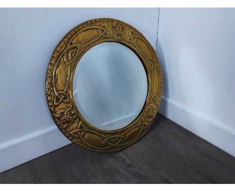 SCOTTISH SCHOOL, ARTS & CRAFTS BRASS CIRCULAR WALL MIRROR, CIRCA 1900 repousse with Celtic knotwork, bevelled glass plate48cm