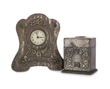 ARTS & CRAFTS HAMMERED PEWTER MANTEL CLOCK, CIRCA 1900 the mechinism by Ansonia, the waisted case repousse with upper floral 