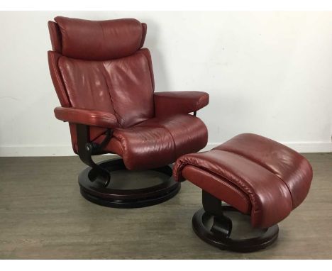 EKORNES, PAIR OF 'STRESSLESS' RECLINER SWIVEL ROCKERS, EACH WITH OTTOMAN  in oxblood leather  110cm high  The first with ligh
