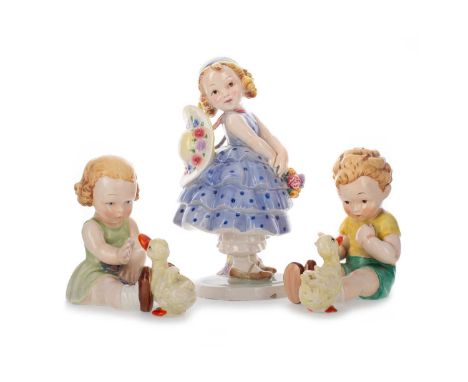 AGNES RICHARDSON FOR GOEBEL, THREE TRENTHAM ART WARE FIGURES`, each modelled in the form of a child, one a girl wearing a blu