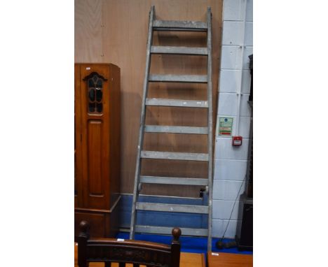 A large vintage decorators ladder of wide proportions