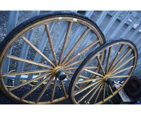A pair of vintage trap or gig wheels, rubber wheels perishing, rim diameter approx 120cm