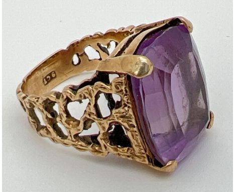 A vintage 9ct gold statement cocktail ring set with a large square cut amethyst in an open work bark effect mount. Stone size