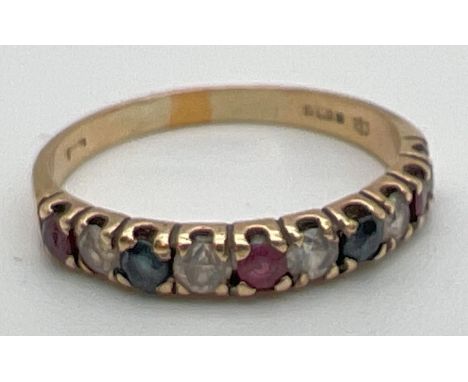 A 9ct gold, ruby, sapphire and clear stone eternity ring, fully hallmarked inside band. Made up of 10 alternating stones. Rin