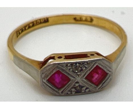 A vintage 18ct gold and platinum Art Deco design ring set with 2 square cut rubies and 2 diamond chips. Stamped 18ct &amp; Pl