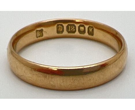 A vintage 18ct gold wedding band ring, fully hallmarked inside band. Weighs approx. 3.9g, band width 4mm. Ring size NÂ½. 