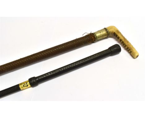 A HUNTING CROP with horn grip, plated collar with fox mask in relief, and plaited leather shaft and a Montfort crop with leat
