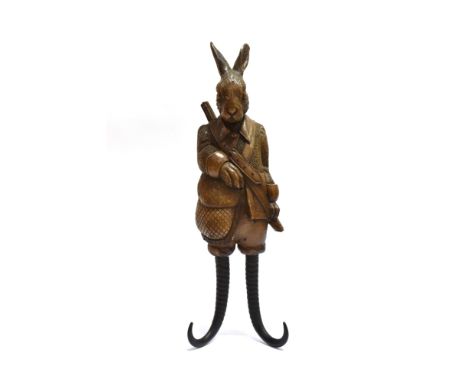 BLACK FOREST STYLE cast resin coat hook bracket in the form of a rabbit in shooting dress with two horn hooks