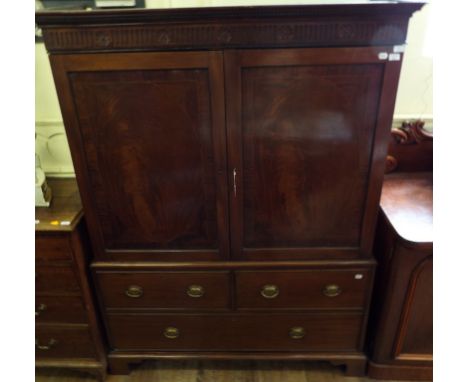 A 19th century mahogany linen press, with two panel doors over three drawers, 140 cm wide Condition report Report by GH

I ca