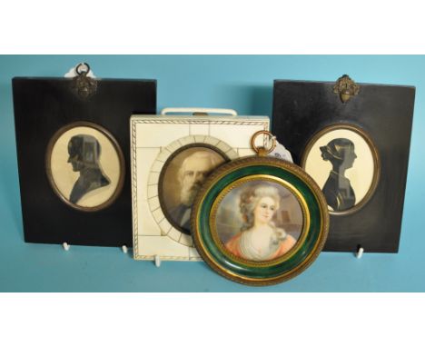 A portrait miniature of a lady, watercolour, in a gilt metal and enamel frame, 12 cm wide, another miniature, and two silhoue