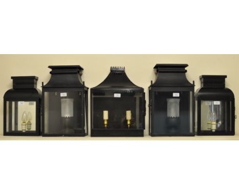 A pair of black painted exterior wall lanterns, possibly by Colefax & Fowler, 44 cm high, a similar two light wall lantern, a