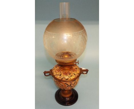 A Royal Doulton stoneware oil lamp, decorated stylised flowers, 50 cm high Condition report Report by GH

Generally very good