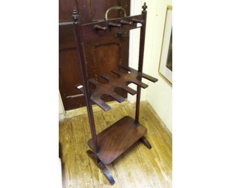 A mahogany whip, stock and boot rack with brass carrying handle, 46 cm wide