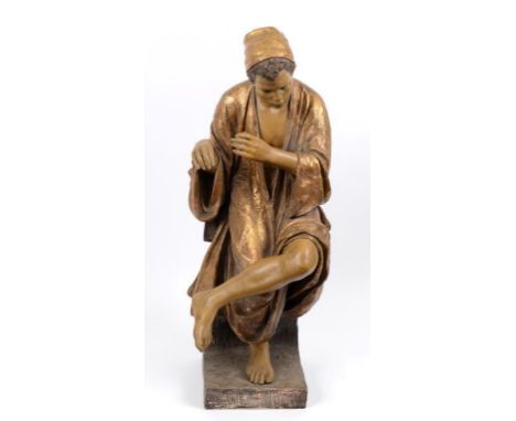 A Goldscheider figure, of a seated flutist, 1366/7/9 (a.f.) 79 cm high  See illustration 