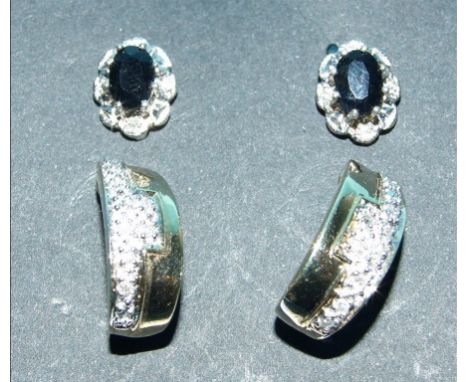 A pair of 9ct gold and diamond earrings, and a pair of 9ct gold, sapphire and diamond stud earrings (2)