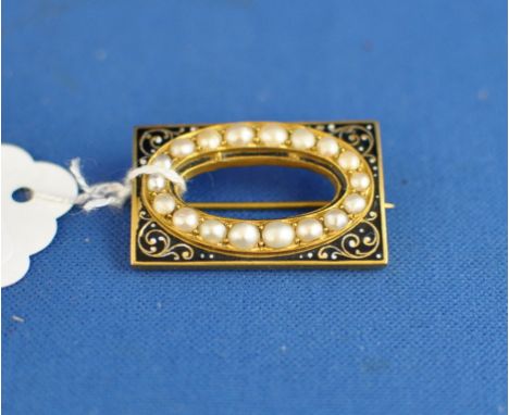 A Victorian memoriam brooch, with enamel decoration, set seed pearls (lacks centre)