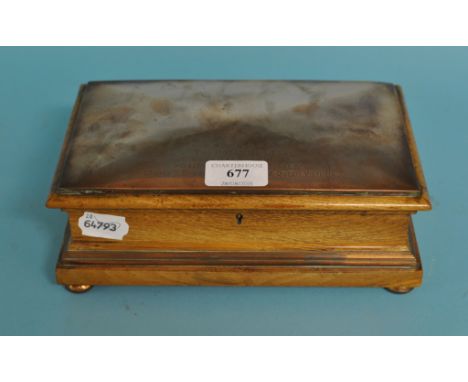 A copper and oak box, made from material from The Royal George, which served as the Royal Yacht of George III, IV, William IV