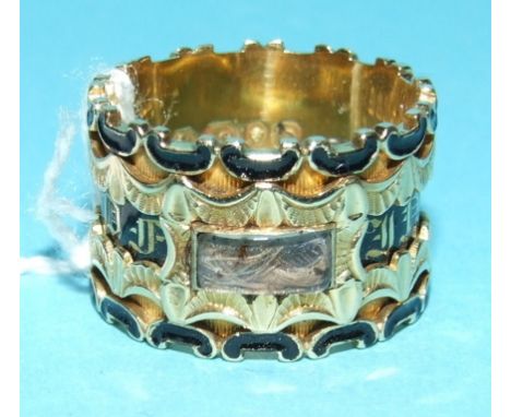 An 18ct gold and enamel memoriam ring, inscribed and with hair locket, boxed  Condition report Report by GH

Weight is 9 g.

