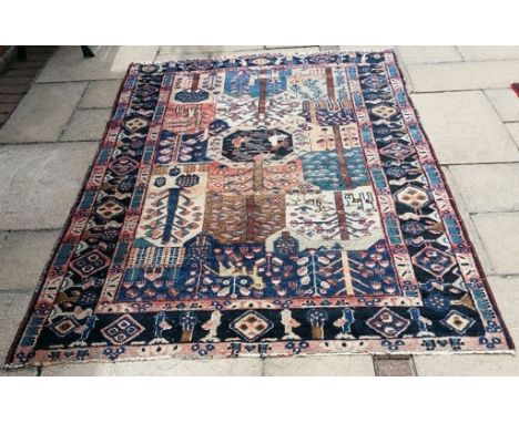 A Persian Bakhtiari rug, 201 x 137 cm