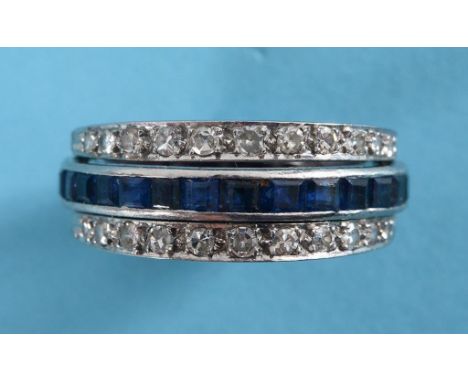 A ruby, sapphire and diamond eternity ring, the centre band set square cut rubies and sapphires, hinged with two diamond half