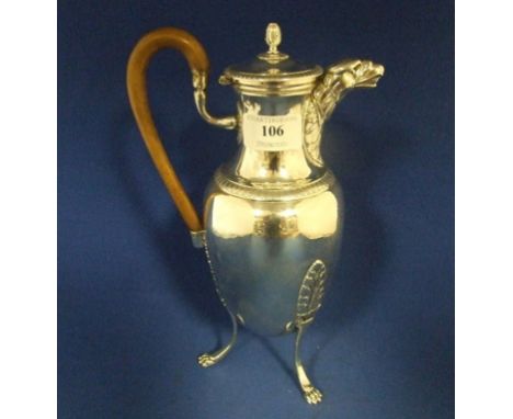 A silver coloured metal hot water jug, with an eagle mask spout, on three leaf capped scroll feet and paw toes, patch repair,