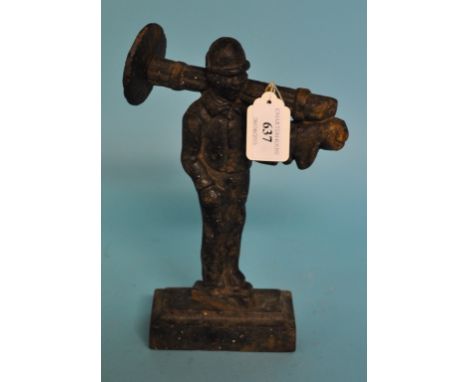 A cast iron door stop, in the form of a chimney sweep, 23.5 cm high