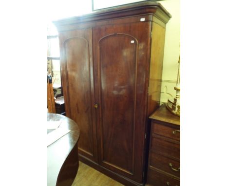 A Victorian mahogany linen press, having a pair of panel doors enclosing trays and drawers, 142 cm wide