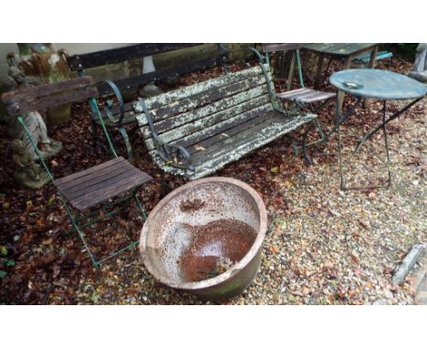 EXTRA LOT: A wrought iron garden bench, 150 cm wide, another, a folding garden table, with two chairs, and a metal dome (6)