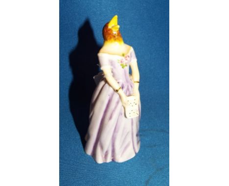 A Royal Worcester candle extinguisher, Confidence, modelled as the singer Jenny Lind, 11 cm high Condition report Report by G